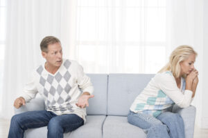 medium-shot-upset-couple-sitting-couch > Rising Dragon Feng Shui