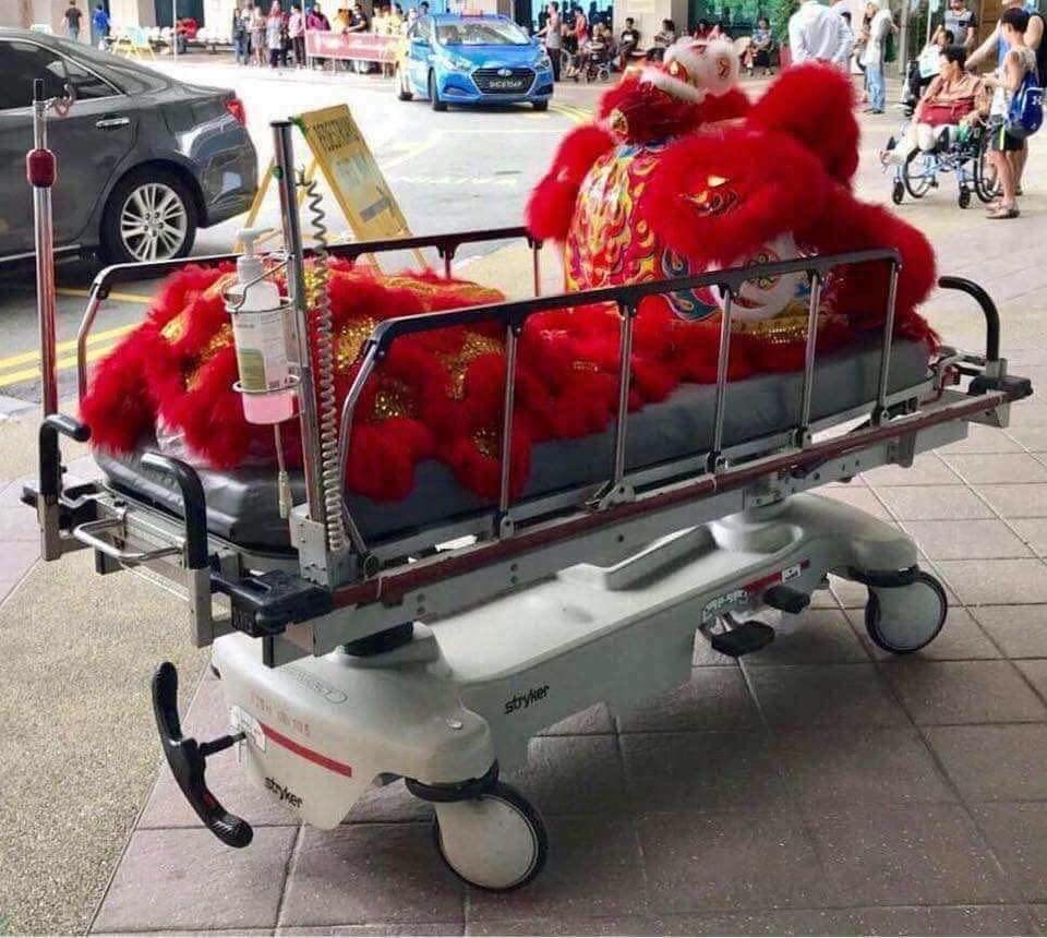 Lion dancer's costume on a hospital stretcher